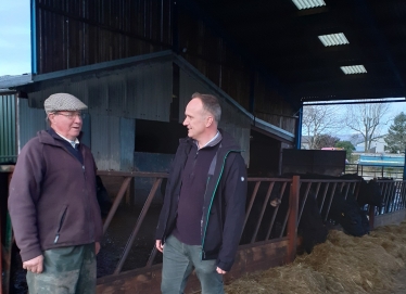 Neil & Farmer in cow shed